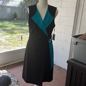 Classic sleeveless mid length black dress